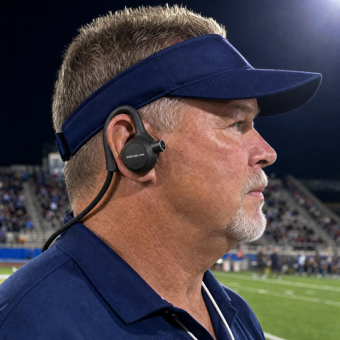 Coach wearing SIDELINE CAM under a visor